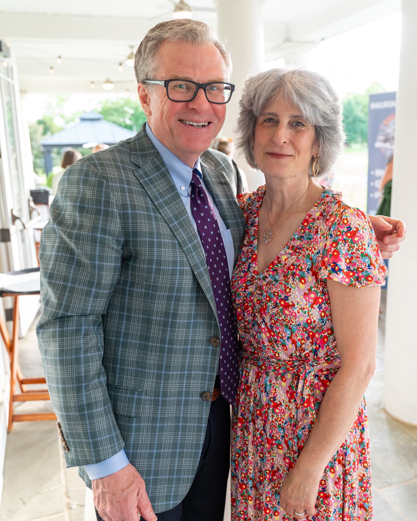 Couple smiling together at a fundraiser gala