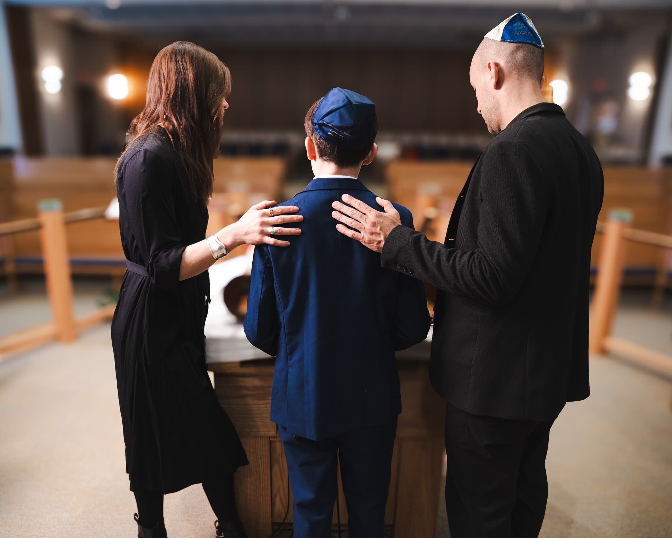 Family blessing at the bimah during a bar mitzvah service