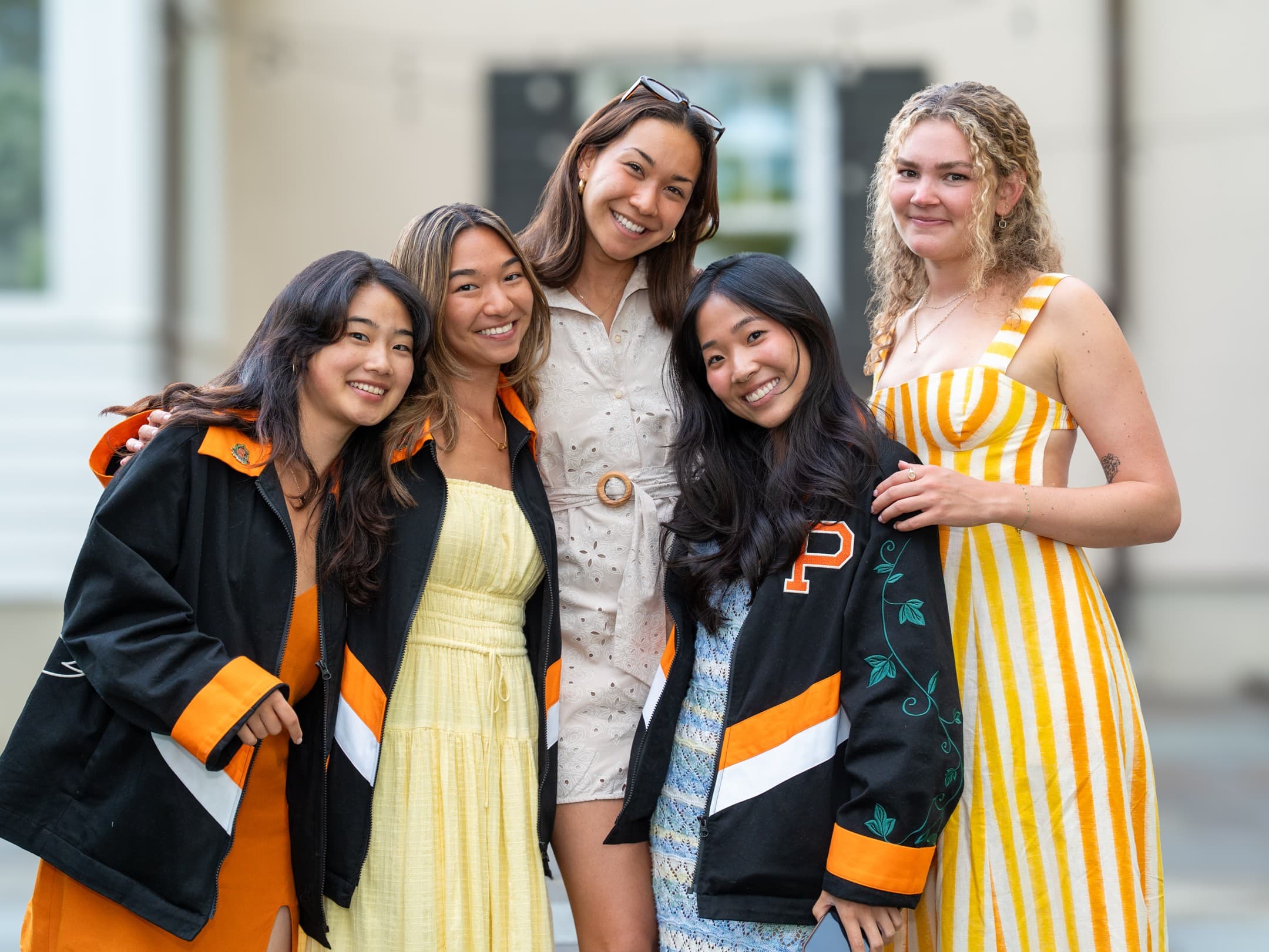 Group of friends smiling at a graduation party
