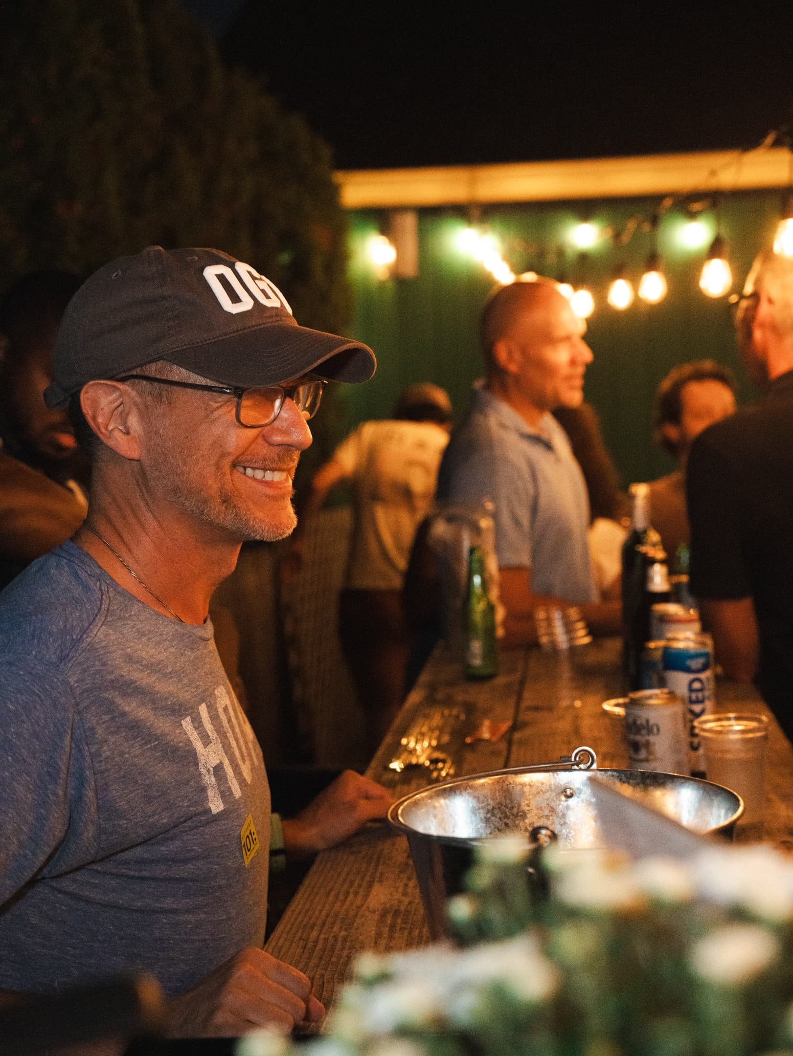 Guests enjoying a backyard private party at night